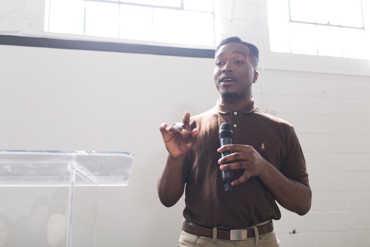 Young man practicing public speaking