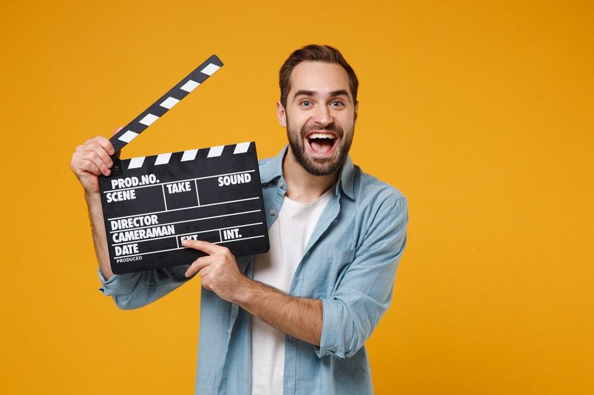 young man with clapboard