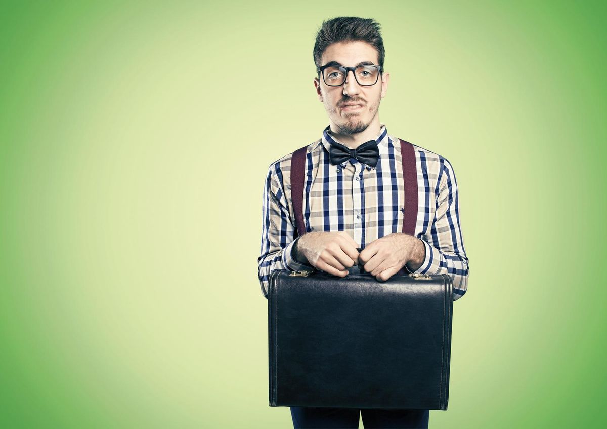 Young shy nerd with case in hands