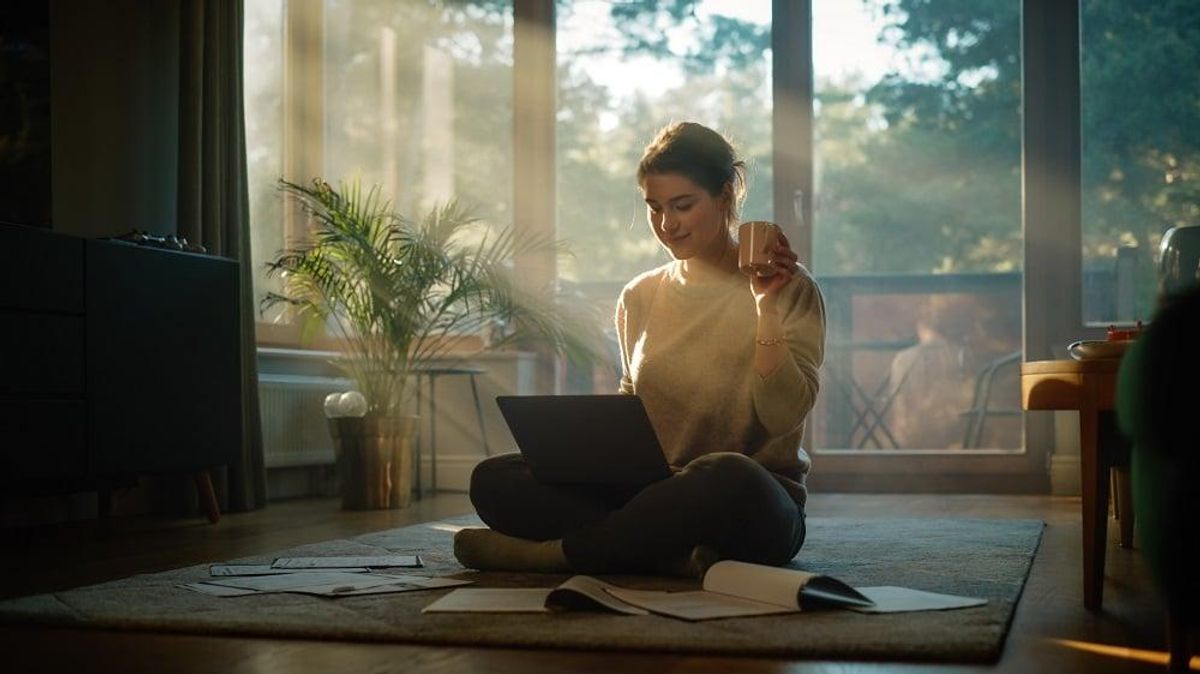 Young woman works remotely